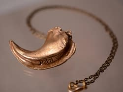 bronze lion claw replica pendant